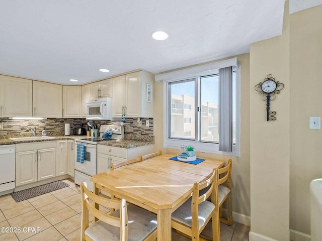 23223 Front Beach Rd Unit A114, Panama City Beach, FL 32413 - dining area with light tile patterned floors, recessed lighting, and baseboards