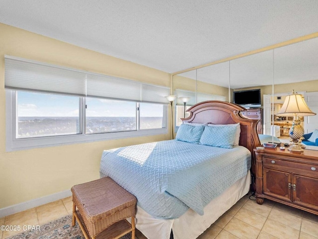 23223 Front Beach Rd Unit A114, Panama City Beach, FL 32413 - bedroom with light tile patterned flooring and baseboards
