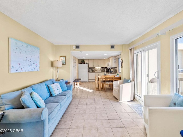 23223 Front Beach Rd Unit A114, Panama City Beach, FL 32413 - living area with light tile patterned floors and a textured ceiling