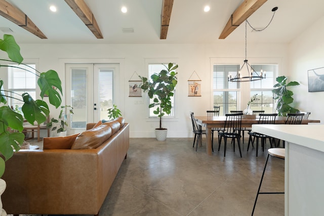 living room with beamed ceiling, plenty of natural light, a chandelier, recessed lighting, and concrete flooring