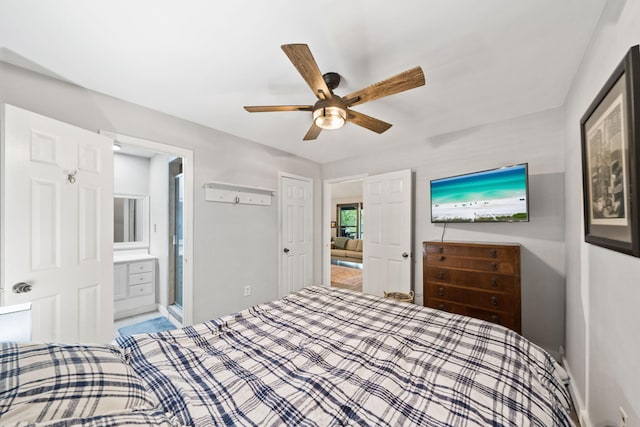 439 Big Cedar Rd, Ponce De Leon, FL 32455 - bedroom with baseboards, connected bathroom, and a ceiling fan