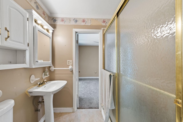 439 Big Cedar Rd, Ponce De Leon, FL 32455 - bathroom with a shower stall, toilet, baseboards, and tile patterned floors