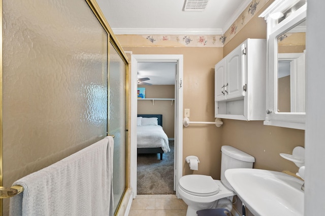 439 Big Cedar Rd, Ponce De Leon, FL 32455 - ensuite bathroom featuring a stall shower, toilet, tile patterned flooring, and a sink