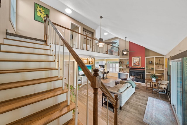 439 Big Cedar Rd, Ponce De Leon, FL 32455 - stairway with a ceiling fan, a fireplace, wood finished floors, high vaulted ceiling, and recessed lighting