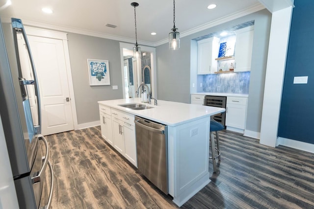 105 Somersault Ln, Inlet Beach, FL 32461 - kitchen with stainless steel appliances, dark wood-style flooring, white cabinetry, an island with sink, and recessed lighting