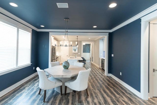 105 Somersault Ln, Inlet Beach, FL 32461 - dining area with crown molding, a chandelier, dark wood finished floors, and recessed lighting
