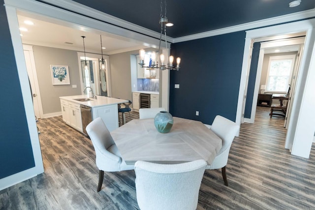 105 Somersault Ln, Inlet Beach, FL 32461 - dining area with beverage cooler, ornamental molding, dark wood finished floors, recessed lighting, and a chandelier