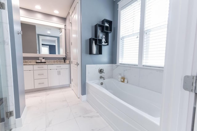 105 Somersault Ln, Inlet Beach, FL 32461 - bathroom featuring double vanity, a garden tub, and marble finish floors