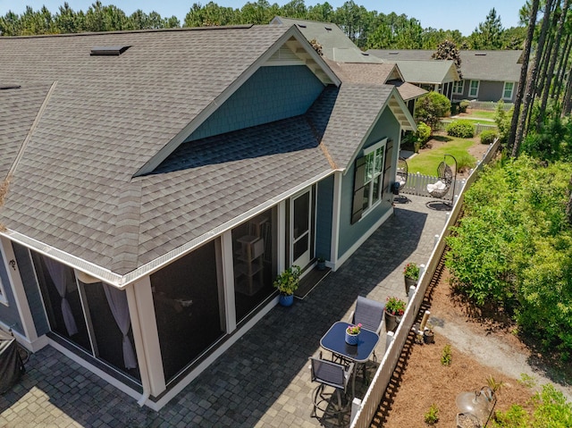 105 Somersault Ln, Inlet Beach, FL 32461 - back of property with a shingled roof and a patio area