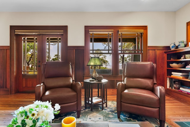 25 17th St, Apalachiacola, FL 32320 - living area with a wainscoted wall, wood finished floors, and wood walls