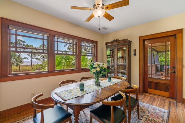 25 17th St, Apalachiacola, FL 32320 - dining room featuring healthy amount of natural light, a ceiling fan, and wood finished floors