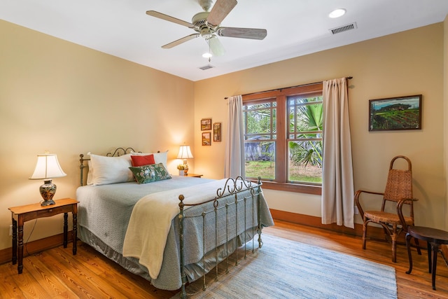 25 17th St, Apalachiacola, FL 32320 - bedroom featuring wood finished floors, baseboards, and ceiling fan