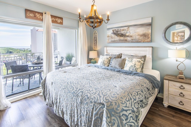 bedroom featuring access to outside, a chandelier, and dark wood-style flooring
