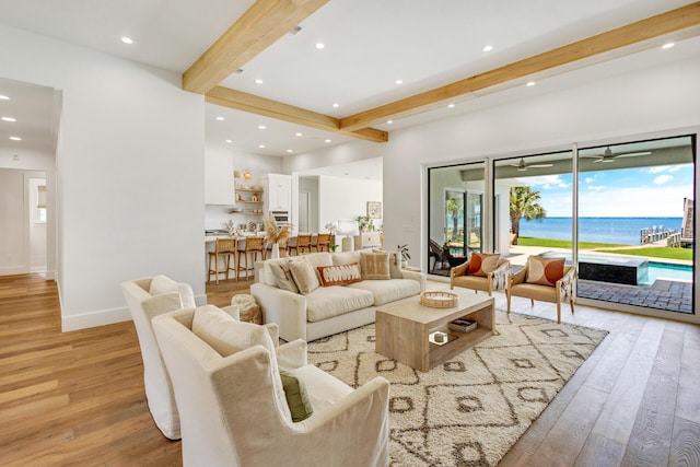 1341 Driftwood Point Rd, Santa Rosa Beach, FL 32459 - living room with beam ceiling, light wood-type flooring, recessed lighting, a water view, and baseboards