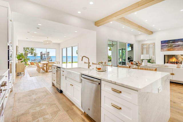1341 Driftwood Point Rd, Santa Rosa Beach, FL 32459 - kitchen with stainless steel dishwasher, a sink, recessed lighting, white cabinetry, and beamed ceiling