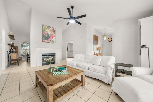 149 Kel Wen Cir, Destin, FL 32541 - living room with light tile patterned flooring, a ceiling fan, a tile fireplace, and high vaulted ceiling