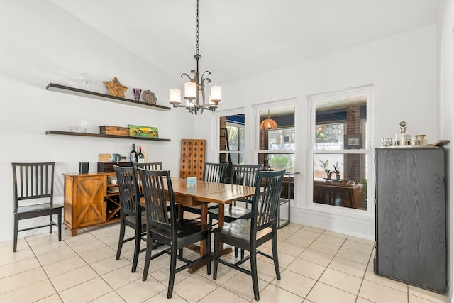 149 Kel Wen Cir, Destin, FL 32541 - dining room featuring a chandelier, light tile patterned flooring, and vaulted ceiling