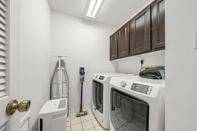 149 Kel Wen Cir, Destin, FL 32541 - washroom featuring cabinet space, separate washer and dryer, light tile patterned flooring, and baseboards
