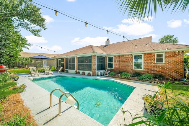 149 Kel Wen Cir, Destin, FL 32541 - outdoor pool with a sunroom and a patio