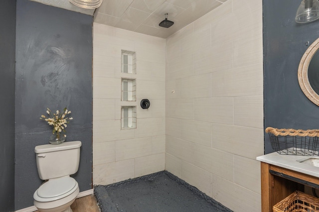 124 Palmetto Dr, Crestview, FL 32539 - full bath with toilet, a tile shower, vanity, and baseboards