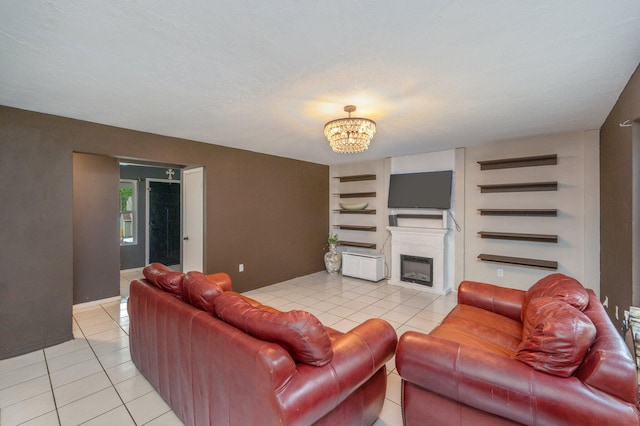 124 Palmetto Dr, Crestview, FL 32539 - living area featuring light tile patterned floors, a chandelier, a fireplace, and built in features