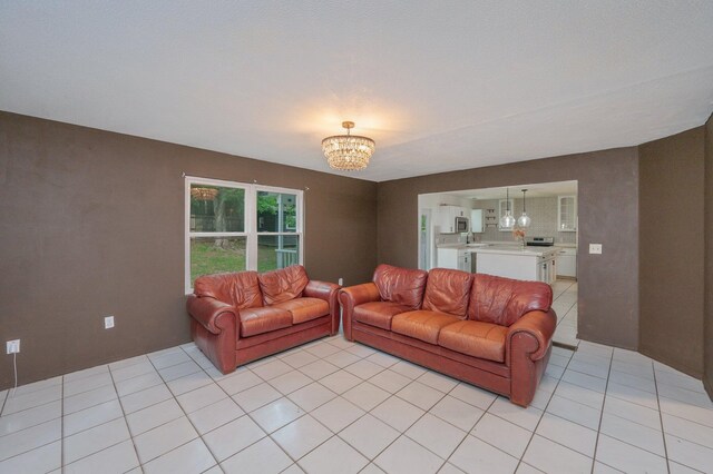 124 Palmetto Dr, Crestview, FL 32539 - living room featuring a chandelier and light tile patterned floors
