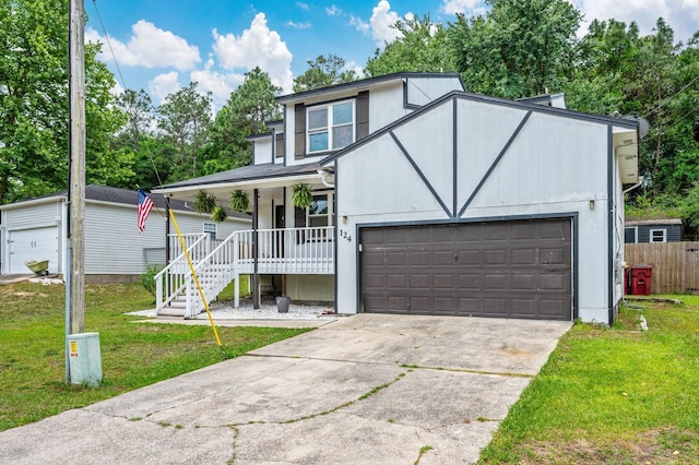 124 Palmetto Dr, Crestview, FL 32539 - view of front facade featuring covered porch, concrete driveway, and an attached garage