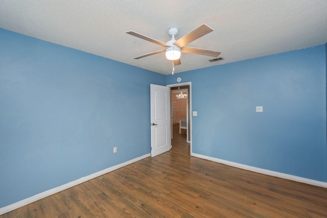 124 Palmetto Dr, Crestview, FL 32539 - empty room featuring baseboards, a ceiling fan, wood finished floors, and a textured ceiling