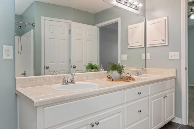 bathroom featuring double vanity