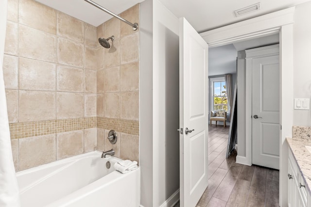 9500 Grand Sandestin Blvd Unit 2325, Miramar Beach, FL 32550 - bathroom featuring baseboards, shower / bathtub combination with curtain, wood finished floors, and vanity