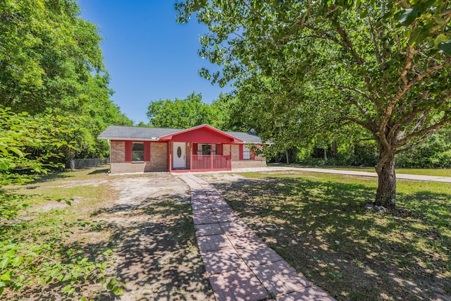 205 Florence Dr, Defuniak Springs, FL 32433 - ranch-style house featuring brick siding and covered porch