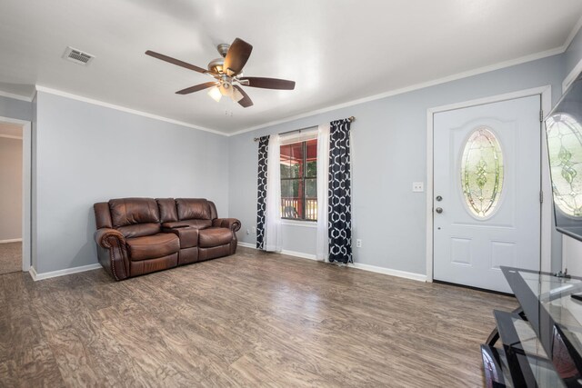 205 Florence Dr, Defuniak Springs, FL 32433 - entrance foyer featuring a ceiling fan, crown molding, baseboards, and wood finished floors