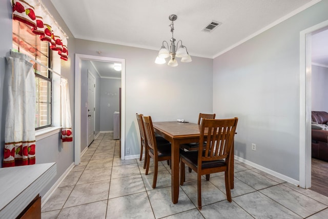 205 Florence Dr, Defuniak Springs, FL 32433 - dining room featuring a chandelier, crown molding, washer / clothes dryer, and baseboards