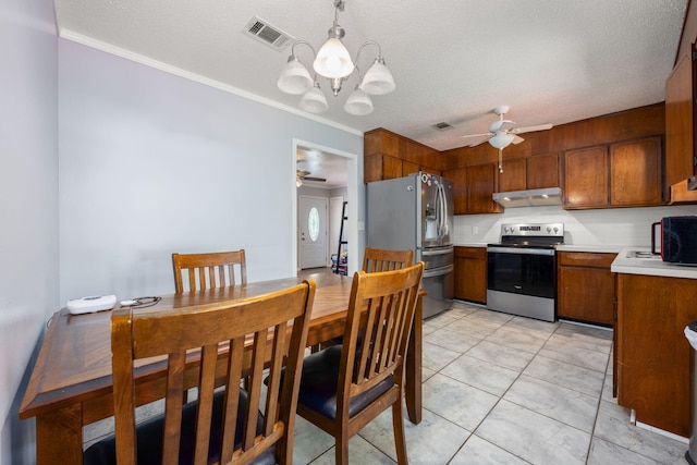 205 Florence Dr, Defuniak Springs, FL 32433 - kitchen with stainless steel appliances, a ceiling fan, under cabinet range hood, light countertops, and crown molding
