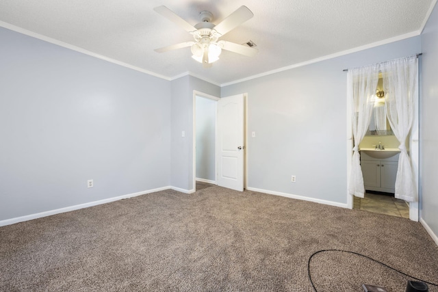 205 Florence Dr, Defuniak Springs, FL 32433 - unfurnished bedroom with carpet flooring, ornamental molding, baseboards, ensuite bathroom, and a ceiling fan