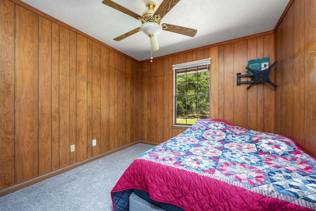 205 Florence Dr, Defuniak Springs, FL 32433 - bedroom featuring carpet flooring, wooden walls, a ceiling fan, and a textured ceiling