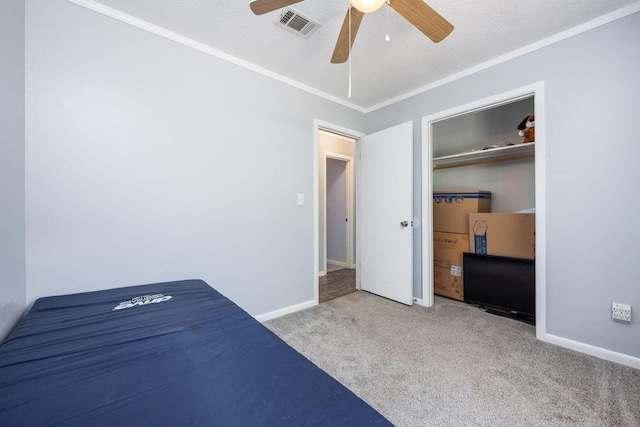 205 Florence Dr, Defuniak Springs, FL 32433 - unfurnished bedroom with carpet, ornamental molding, baseboards, and ceiling fan