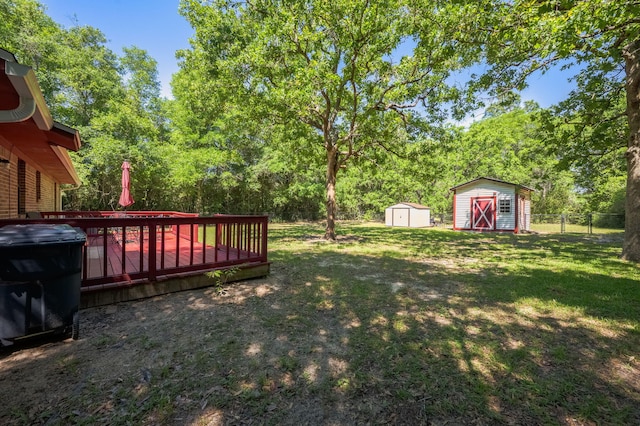 205 Florence Dr, Defuniak Springs, FL 32433 - view of yard featuring a storage shed, an outbuilding, and a deck