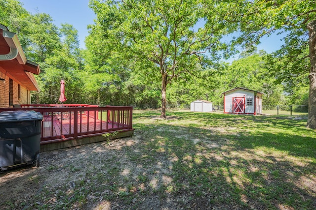 205 Florence Dr, Defuniak Springs, FL 32433 - view of yard with a shed, an outbuilding, and a wooden deck