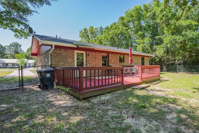 205 Florence Dr, Defuniak Springs, FL 32433 - back of property with brick siding and a deck