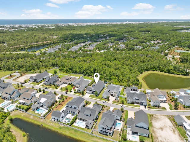 aerial perspective of suburban area with a large body of water