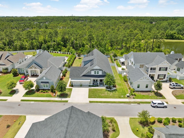 aerial view of residential area with a heavily wooded area