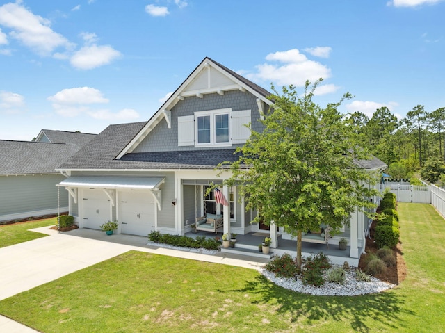 view of front of house with covered porch, roof with shingles, concrete driveway, and a garage