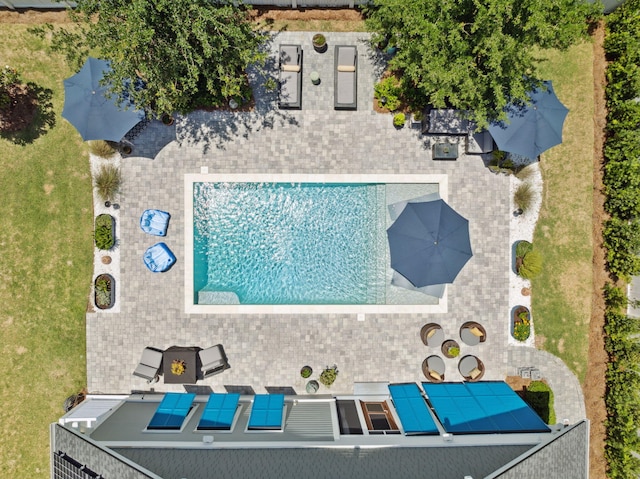 aerial view of property and surrounding area with a pool