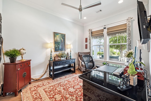 office area featuring a ceiling fan, wood finished floors, recessed lighting, baseboards, and crown molding