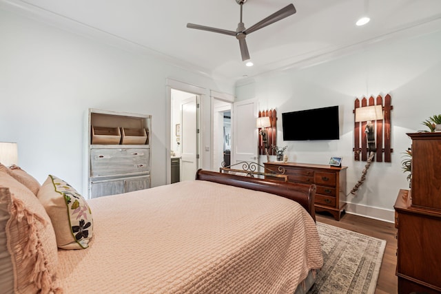 bedroom featuring dark wood-style flooring, recessed lighting, baseboards, ensuite bathroom, and ceiling fan