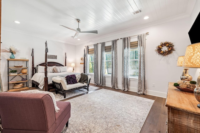 bedroom with dark wood-type flooring, baseboards, ornamental molding, ceiling fan, and recessed lighting
