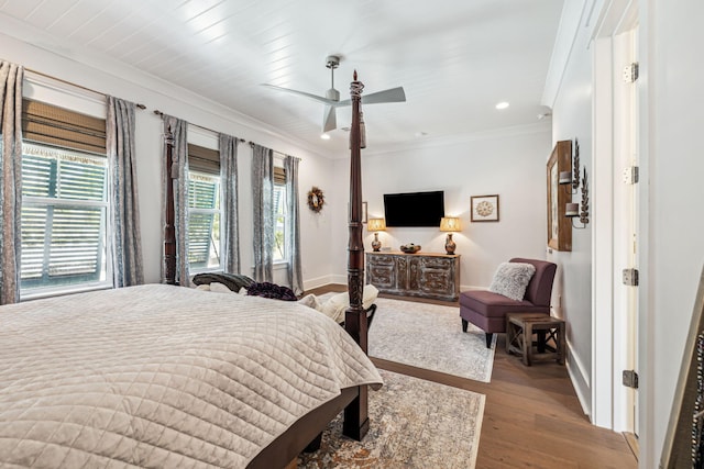 bedroom featuring baseboards, ornamental molding, wood finished floors, recessed lighting, and ceiling fan