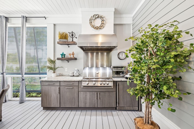 kitchen featuring wood ceiling, dark brown cabinetry, wall chimney exhaust hood, open shelves, and light wood-style flooring