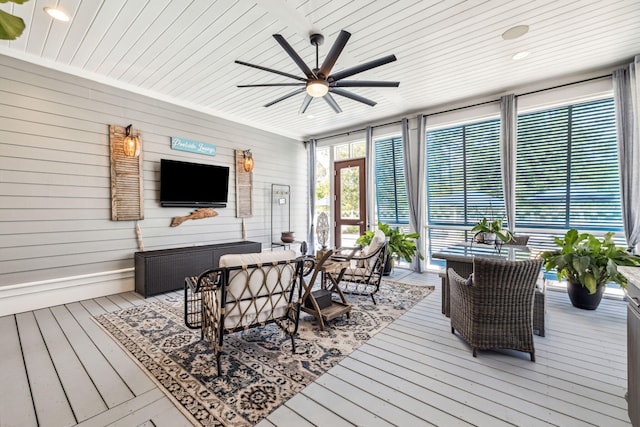 wooden deck with a ceiling fan and outdoor dining space